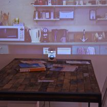 Installation with Video, Table, chairs, Magazines and Speaker (2012)